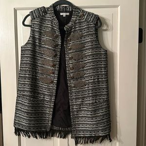 Adorned vest with silver beading and buttons.